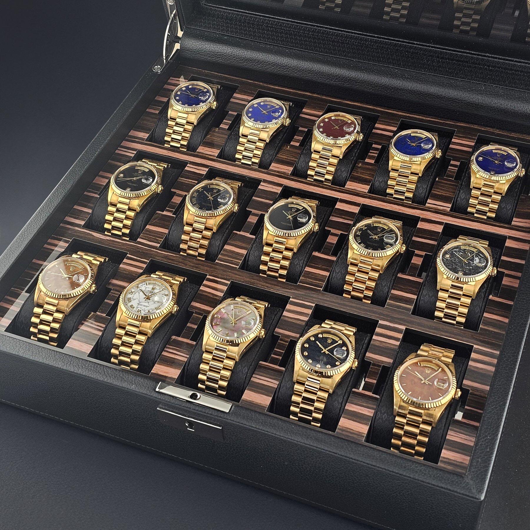 Gold-tone watch collection in display case